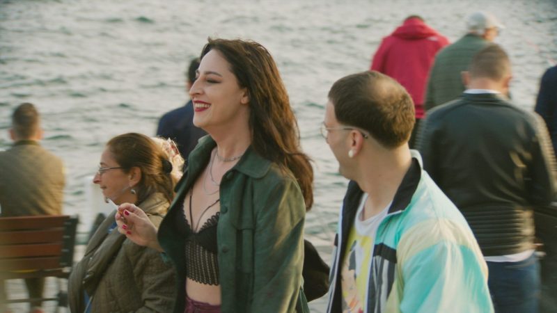 A man and woman walking on a boat